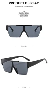 Close-up of oversized black rimless frame sunglasses with gray lenses in dual view