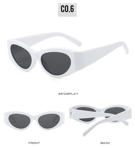 Detailed views of vintage cat eye sunglasses in glossy white frame with dark lenses