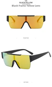 Detail view of oversized rimless sunglasses featuring black frame and yellow mirror lenses