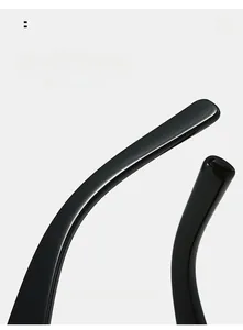 Detailed macro view of curved ergonomic black temples on vintage cat eye sunglasses