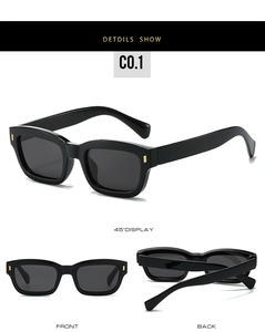 Detail view of vintage square sunglasses with black frame and golden metal accents