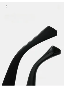 Macro shot of curved black sunglass legs with ergonomic arc design for comfort