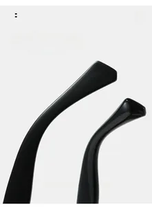 Close-up of curved mirror legs on black square sunglasses with ergonomic design