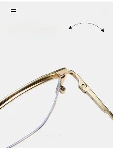 Detail of durable metal hinge on golden cat-eye glasses frame with smooth folding design