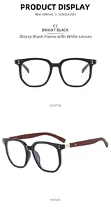 Macro detail of large retro black eyeglass frames with wood grain textured temples