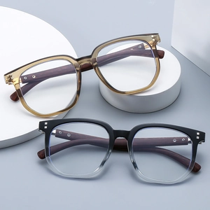 Modern square oversized glasses frames with wood grain temples on white geometric stands