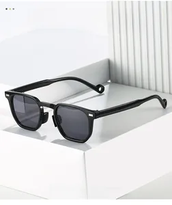 Close-up of stylish black polygonal sunglasses with hollow tips on a white pedestal