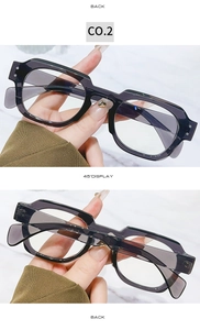 Detail view of stylish thick black square frame glasses with grey lenses and acetate finish