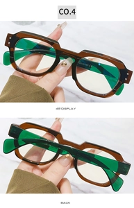 Detail view of square blue light blocking glasses in brown and green with CE mark