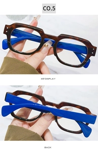 Detail view of tortoiseshell and navy blue square frame glasses with vintage style