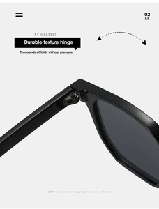 Detailed close-up of durable metal hinge on black polygonal sunglasses frames