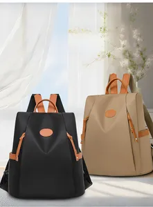 Waterproof anti-theft oxford backpacks in black and khaki with brown leather details