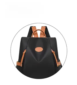 Detail showing the contrast stitching and waterproof oxford fabric of this travel backpack