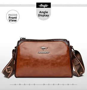 Close-up of brown textured leather shoulder bag featuring kangaroo logo and woven strap