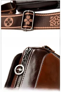 Detail of wax leather pillow bag with floral strap and metallic kangaroo logo zipper