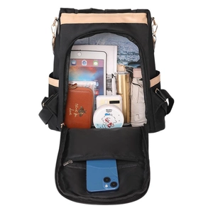 Large capacity black and beige backpack showing organized interior storage for travel