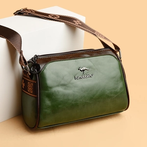 Retro wax leather pillow bag for women with dark green finish and wide shoulder strap