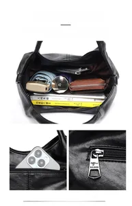 Detailed interior of black pebbled leather tote showing multi-compartment storage space