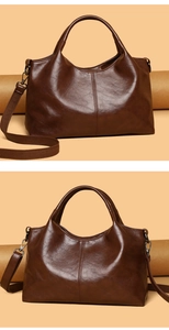 Detail of vintage brown tote bag with oily leather texture and detachable strap