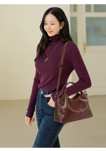 Brown soft faux leather shoulder bag with vertical stitching and adjustable strap
