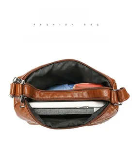 Deep brown crossbody bag interior showing multiple compartments and large capacity space