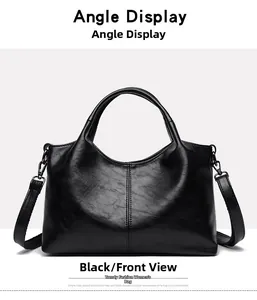 Front view of black faux leather tote bag with vertical stitching and detachable strap