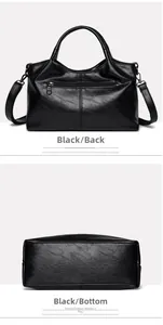 Detail view of black soft leather tote bag showing back zipper pocket and reinforced bottom