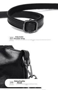 Detail of adjustable strap buckle and detachable metal hook on soft black leather bag