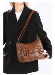Brown PU leather shoulder bag featuring multi-zipper pockets and an adjustable strap