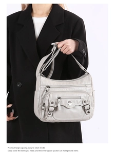 Detailed view of the large capacity soft PU leather shoulder bag with multi-pocket design