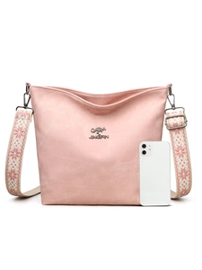 Sac bandoulière en toile rose avec sangle brodée et téléphone pour l'échelle de taille