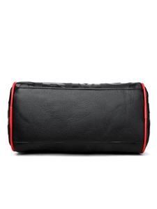 Close-up of black lychee leather handbag with red trim and embossed logo detail
