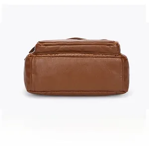 Detailed bottom view of brown leather bag showing premium stitching and rectangular structure