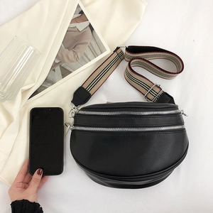 Black lychee leather crescent crossbody bag with striped wide strap and silver zippers