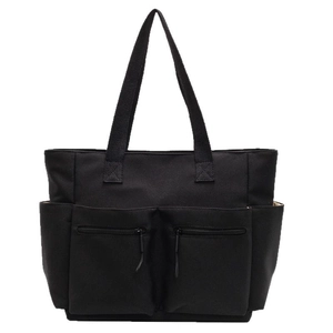 Black large capacity canvas tote bag with multi-pocket design and shoulder straps