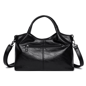 Classic black leather minimalist tote bag with dual handles and crossbody strap