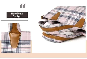 Close-up of brown PU leather handle and metal ring detail on pink plaid tote bag