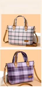 Detail of plaid tote bag with vintage leather handles and adjustable shoulder strap