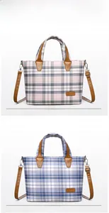 Pink and blue plaid canvas tote bags with adjustable leather straps and silver buckles