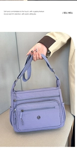 Detail of light purple waterproof nylon crossbody bag with multiple zip pockets and strap