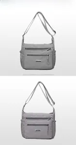 Close-up of nylon crossbody bags featuring multi-layer zippers and adjustable shoulder straps