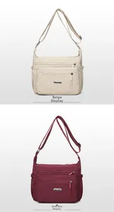 Detail showing beige and wine red nylon crossbody bags with multi-zipper pocket design