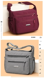Detail of high-density nylon multi-pocket crossbody bag with metallic logo and adjustable strap