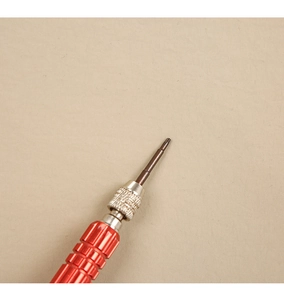 Detail of red knurled handle and precision Torx head for non-slip electronics repair