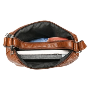 Brown soft leather multi-compartment shoulder bag with spacious interior storage