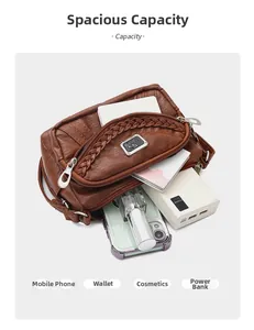 Internal view of the brown soft leather crossbody bag showing large multi-layer capacity