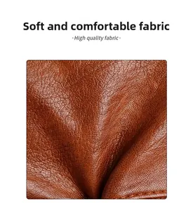Close-up of premium brown leather with natural lychee grain texture and soft folds