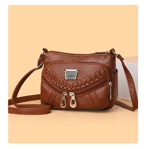 Brown vintage faux leather crossbody bag with multiple zip pockets and woven texture