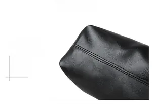 Detail of a black leather tote bag with professional double stitching and premium texture