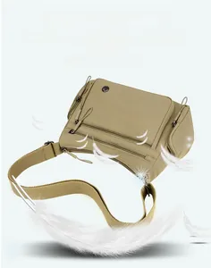 Close-up of light khaki oxford crossbody bag showing double front zipper pockets